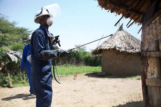 IRS spray operator carrying out house spraying during IRS spray campaign, Ethiopia, 2014