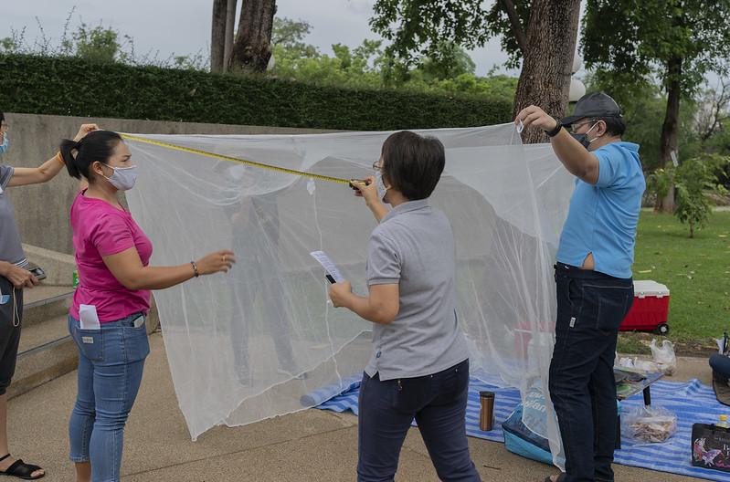 Staff of Inspection Committee from the Department of Disease Control (DDC), Ministry of Public Health (MOPH), Thailand measuring the Long-Lasting Insecticidal Net (LLIN) to make an assessment of the quality standard. USAID/PMI and Global Fund provided LLINs to the Royal Thai Government in an effort to eliminate malaria.